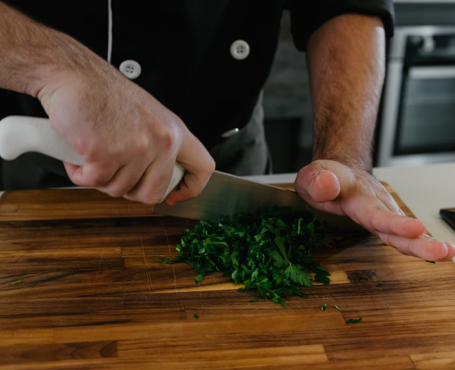 Chef's knife on a wooden cutting board