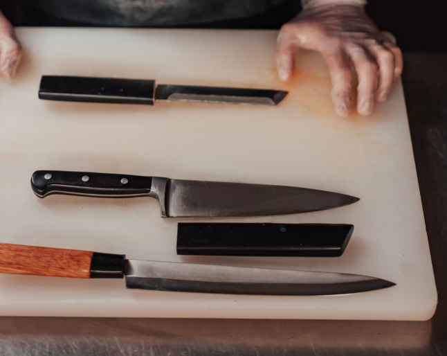 Hand sharpening a knife on a whetstone